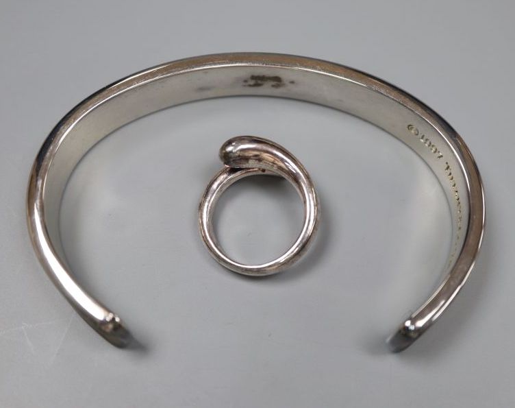 A modern Tiffany and Co 925 snake ring, size M and a Tiffany & Co 925 bangle, both with pouch and box.